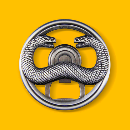 Thulsa Doom Bottle Opener - Battered Steel on a yellow background